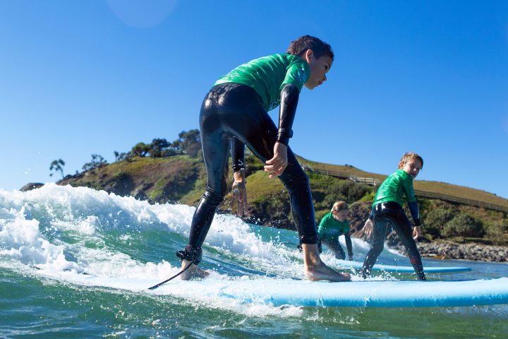 a man riding a wave on a surfboard in the water